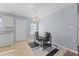 Cozy dining area with a modern table and chairs set under a stylish chandelier at 7013 Mahonia Pl, Lithonia, GA 30038