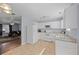 Bright kitchen with white cabinets and appliances, offering a clean, functional space at 7013 Mahonia Pl, Lithonia, GA 30038