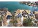 Aerial view of the houses on the lake with trees around at 2387 Battle Dr, Villa Rica, GA 30180