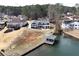 Aerial view of the house with a lake and dock on the water at 2387 Battle Dr, Villa Rica, GA 30180