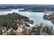 High angle aerial shot showing numerous lakefront homes and lush forest around the water at 2387 Battle Dr, Villa Rica, GA 30180