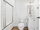 Bright bathroom featuring a glass-enclosed shower and stylish white vanity at 2387 Battle Dr, Villa Rica, GA 30180