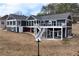 Back exterior of the home with multiple decks, staircases, kayaks stored under the deck and views at 2387 Battle Dr, Villa Rica, GA 30180