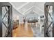 Inviting foyer with hardwood floors, vaulted ceilings, and elegant details creating a warm welcome at 2387 Battle Dr, Villa Rica, GA 30180