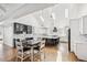 Modern kitchen with white cabinets, granite countertops, and a spacious island for meal prep and casual dining at 2387 Battle Dr, Villa Rica, GA 30180