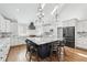 Spacious kitchen with a large center island, granite countertops, and modern stainless steel appliances at 2387 Battle Dr, Villa Rica, GA 30180