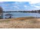 Beautiful lake view showcasing a lakeside gazebo and a peaceful scene along the water's edge at 2387 Battle Dr, Villa Rica, GA 30180