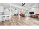 Expansive living room with hardwood floors, wicker furniture, pool table, and recessed lighting at 2387 Battle Dr, Villa Rica, GA 30180