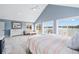 Spacious main bedroom with vaulted ceilings, lake views, and lots of natural light at 2387 Battle Dr, Villa Rica, GA 30180