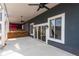 Covered patio area with ceiling fans and sliding glass doors overlooking the backyard at 2387 Battle Dr, Villa Rica, GA 30180