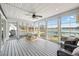 Cozy sunroom with great lake views, ceiling fan, and outdoor seating at 2387 Battle Dr, Villa Rica, GA 30180