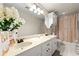 Bathroom with dual sinks, vanity, framed mirror and shower/tub with decorative curtain at 4184 Wyndham Park Cir, Decatur, GA 30034