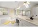Bright bathroom with dual vanities, tub, and a large mirror with great lighting at 4184 Wyndham Park Cir, Decatur, GA 30034