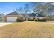 Charming single-story brick home featuring manicured landscaping and attached two car garage at 4184 Wyndham Park Cir, Decatur, GA 30034