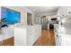 White kitchen island featuring stone countertops, cabinet storage, and hardwood flooring at 4184 Wyndham Park Cir, Decatur, GA 30034