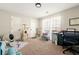 Carpeted home office with dual closets, desk, chair and cat trees at 4184 Wyndham Park Cir, Decatur, GA 30034