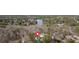 Expansive aerial view showcasing property with lake access and lush, mature landscaping at 300 Mill Creek Ct, Acworth, GA 30101