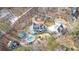 Drone view of property highlighting circular driveway, pool and stone landscaping at 300 Mill Creek Ct, Acworth, GA 30101