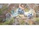 Aerial view showcases the property's layout with a pool, multiple structures, and mature trees at 300 Mill Creek Ct, Acworth, GA 30101