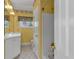 Well-lit bathroom featuring a shower, vanity, and floral wallpaper at 300 Mill Creek Ct, Acworth, GA 30101