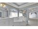 Bathroom featuring a soaking tub, vanity and patterned wallpaper at 300 Mill Creek Ct, Acworth, GA 30101
