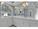 Bathroom featuring white cabinetry and dual sinks at 300 Mill Creek Ct, Acworth, GA 30101