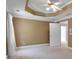 Bedroom featuring a trey ceiling, ceiling fan and large windows at 300 Mill Creek Ct, Acworth, GA 30101