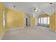 Bright bonus room featuring neutral carpet, large windows and a ceiling fan at 300 Mill Creek Ct, Acworth, GA 30101