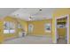 Bright bonus room featuring neutral carpet, large windows and a ceiling fan at 300 Mill Creek Ct, Acworth, GA 30101