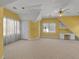 Bright bonus room featuring neutral carpet, large windows and a ceiling fan at 300 Mill Creek Ct, Acworth, GA 30101
