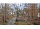 Long driveway leads to a private residence surrounded by mature trees and natural beauty at 300 Mill Creek Ct, Acworth, GA 30101