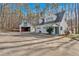 Exterior view of the home showing 2-car garage and additional outbuilding at 300 Mill Creek Ct, Acworth, GA 30101