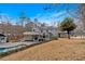 Elegant home with a pool and well-manicured lawn, offering stunning curb appeal at 300 Mill Creek Ct, Acworth, GA 30101