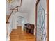 Elegant foyer featuring hardwood floors, a staircase, and a decorative glass door at 300 Mill Creek Ct, Acworth, GA 30101