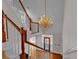 Elegant foyer with hardwood floors, staircase, and decorative chandelier at 300 Mill Creek Ct, Acworth, GA 30101