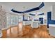 Expansive kitchen with white cabinetry, a central island, hardwood flooring, and natural light at 300 Mill Creek Ct, Acworth, GA 30101
