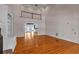 Open-concept living room featuring hardwood floors, a balcony, and bright natural light at 300 Mill Creek Ct, Acworth, GA 30101