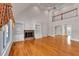 Spacious living room with a fireplace, built-in bookshelves, and hardwood flooring at 300 Mill Creek Ct, Acworth, GA 30101