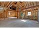 Unfinished living room with unfinished insulation and exposed studs and floorboards at 300 Mill Creek Ct, Acworth, GA 30101