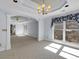 Bright main bedroom with large windows offering wooded views at 300 Mill Creek Ct, Acworth, GA 30101