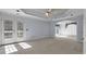 Spacious main bedroom with ceiling fan, carpet, and exterior access at 300 Mill Creek Ct, Acworth, GA 30101