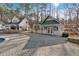 Pool area with guest house on the property with stone tile flooring around the pool at 300 Mill Creek Ct, Acworth, GA 30101