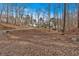 Picturesque home nestled among mature trees offering privacy and a serene setting at 300 Mill Creek Ct, Acworth, GA 30101