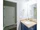 Bathroom with a blue vanity, granite countertop, and neutral color walls at 4162 Roberts Crest Dr, Suwanee, GA 30024