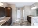 Elegant bathroom features double sinks, granite countertops, and dark wood cabinetry at 4162 Roberts Crest Dr, Suwanee, GA 30024