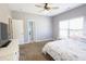 Inviting bedroom with a view of the pool, bright natural light, and plush carpet at 4162 Roberts Crest Dr, Suwanee, GA 30024