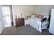 Cozy bedroom featuring warm carpet, an accent chair and complementary decor at 4162 Roberts Crest Dr, Suwanee, GA 30024
