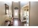 Elegant foyer with hardwood floors, a decorative table, and an inviting view into the adjacent living space at 4162 Roberts Crest Dr, Suwanee, GA 30024