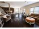 Open living room with hardwood floors leads to kitchen with center island and dining area at 4162 Roberts Crest Dr, Suwanee, GA 30024
