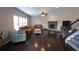 Living room with hardwood floors, brick fireplace, staircase, and plenty of seating at 4162 Roberts Crest Dr, Suwanee, GA 30024